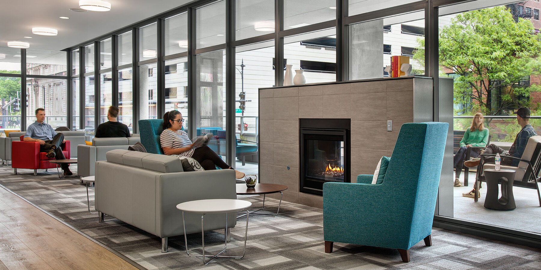 Luxury Apartment Complex Construction - 30 East interior amenity lounge space with fireplace