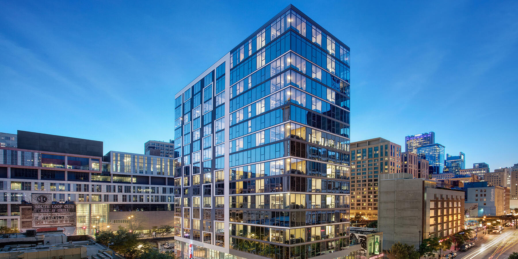 Luxury Apartment Complex Construction - 30 East exterior building at dusk