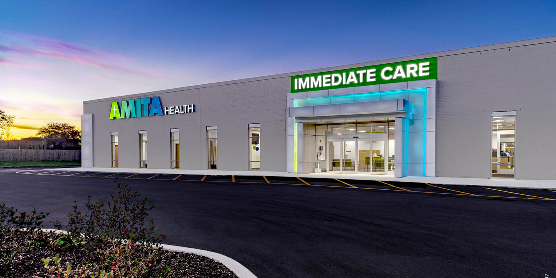 Healthcare and Hospital Construction - Amita Health exterior at dusk