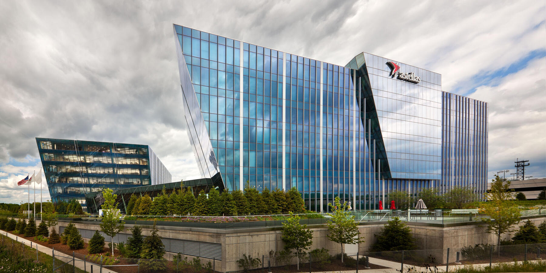 Corporate Office Construction - Astellas Pharma Headquarters exterior view with curtainwall and terraced landscaping