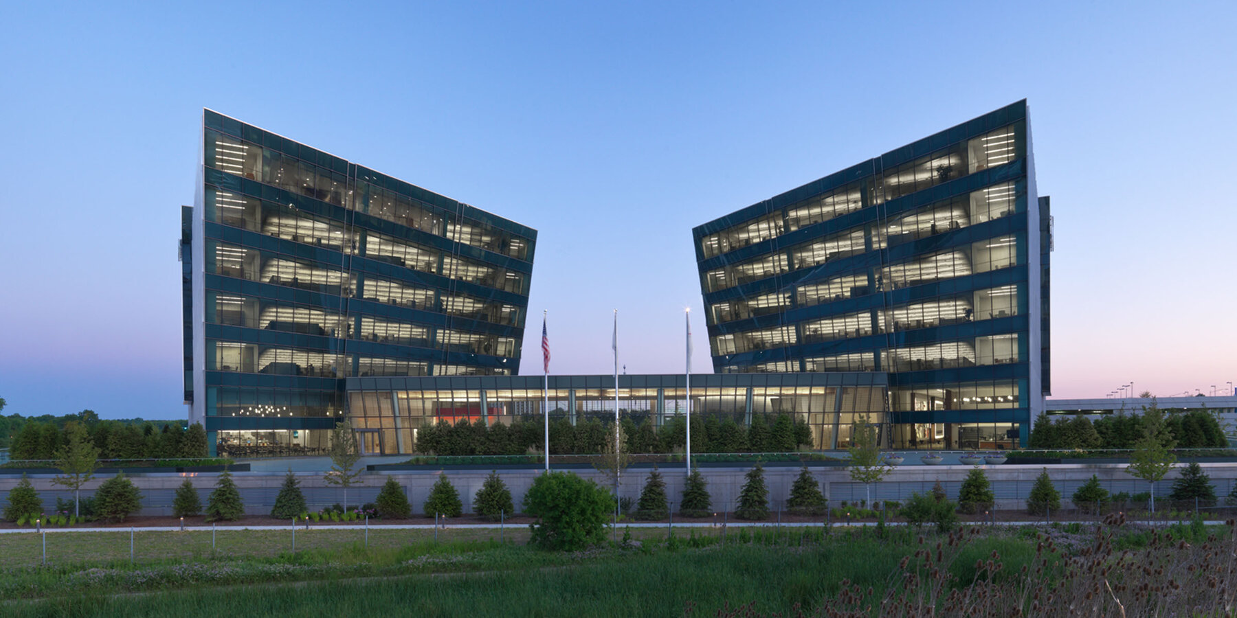 Corporate Office Construction - Astellas Pharma Headquarters two buildings exterior at dusk