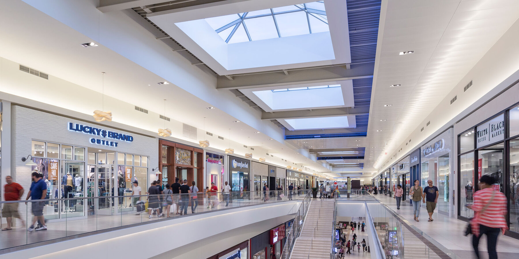 Retail & Mall Construction Company - Fashion Outlets Chicago atrium with skylights and store entrances