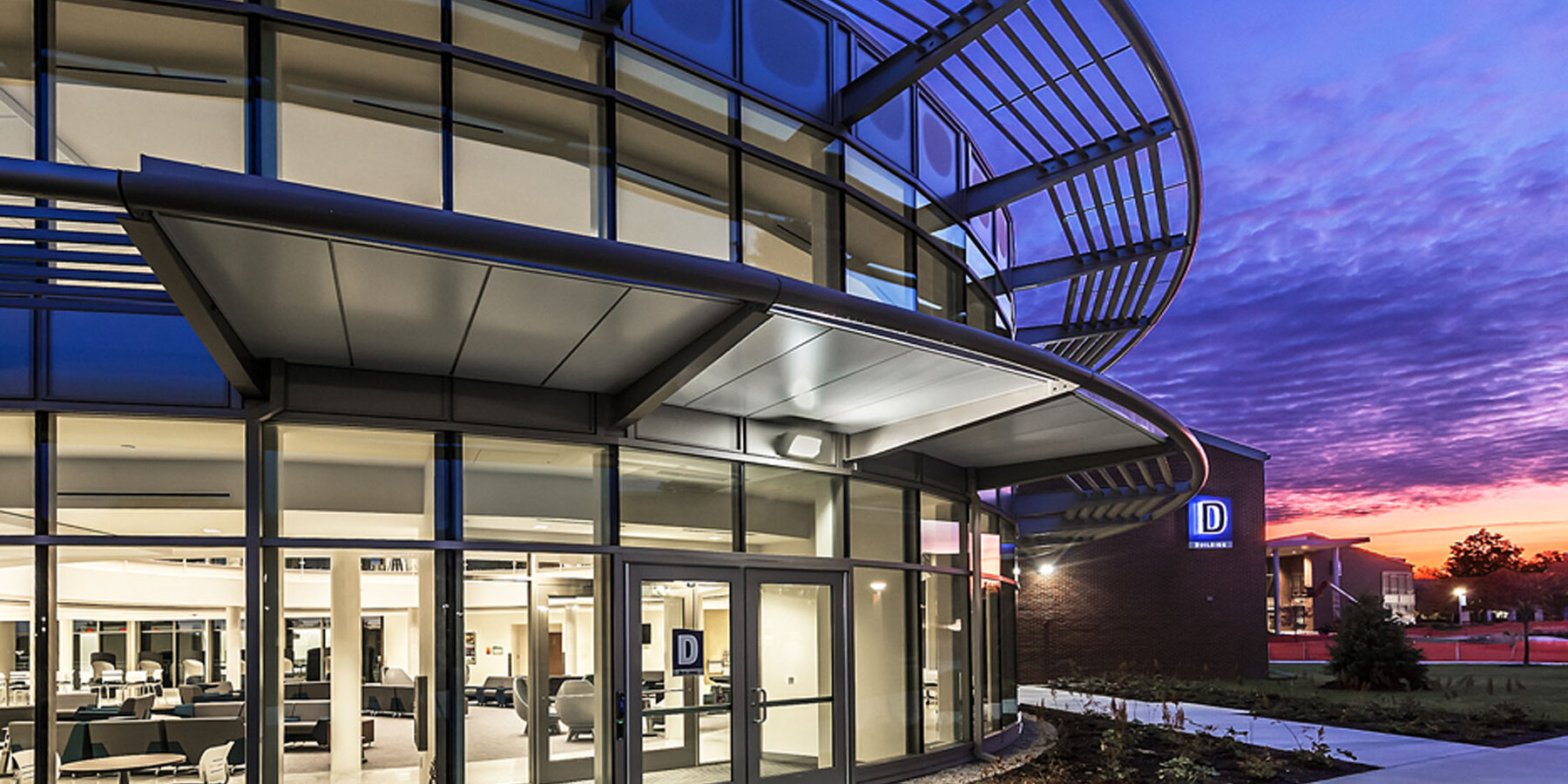 Higher education construction - Harper College campus exterior at dusk