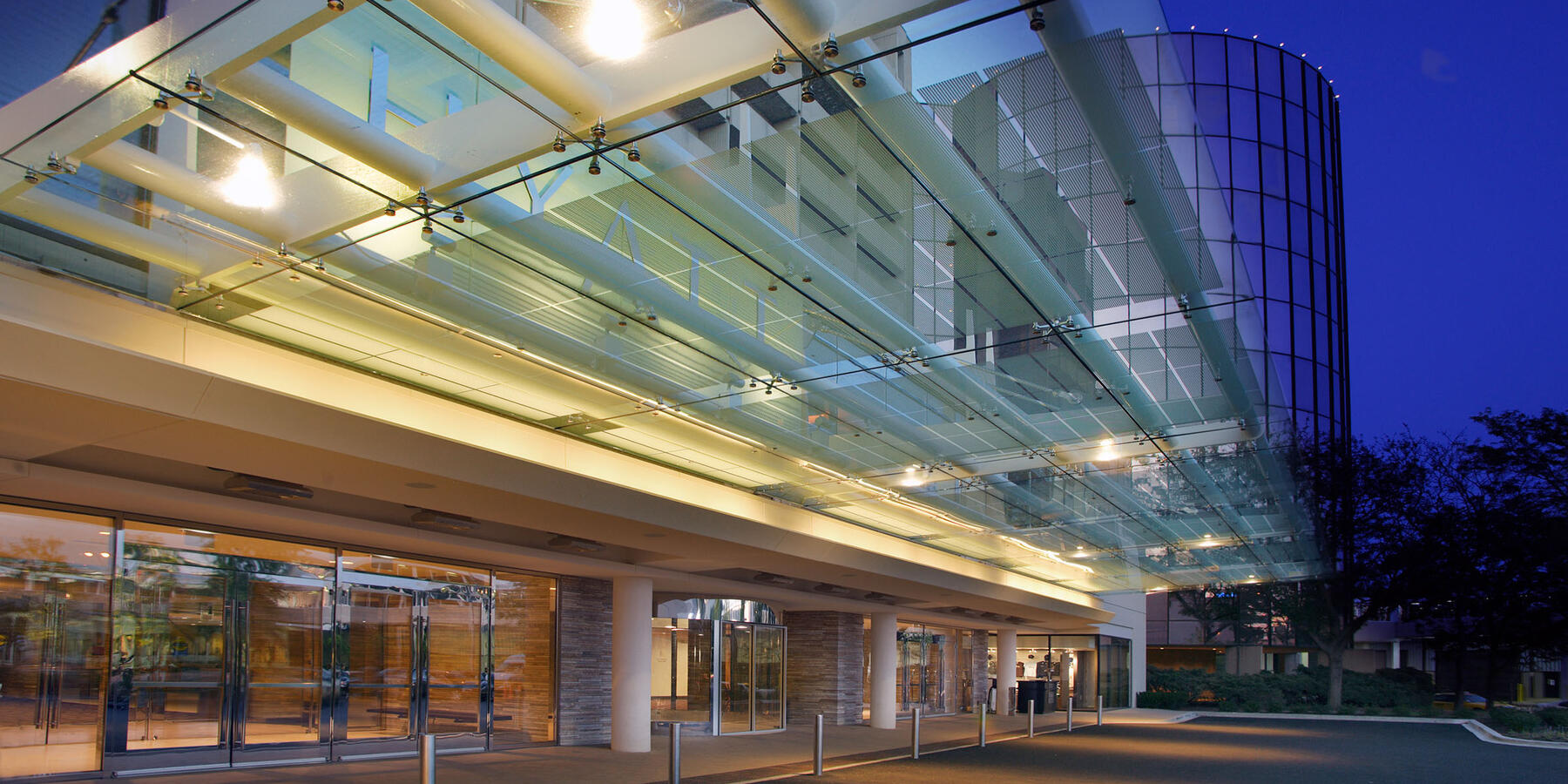 Hotel Construction & Renovation - Hyatt Regency O'Hare exterior entrance and driveway at night