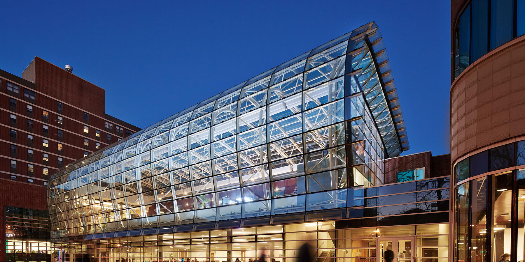 Chicago Life Science Construction - Loyola Chicago IES exterior entrance with atrium at dusk