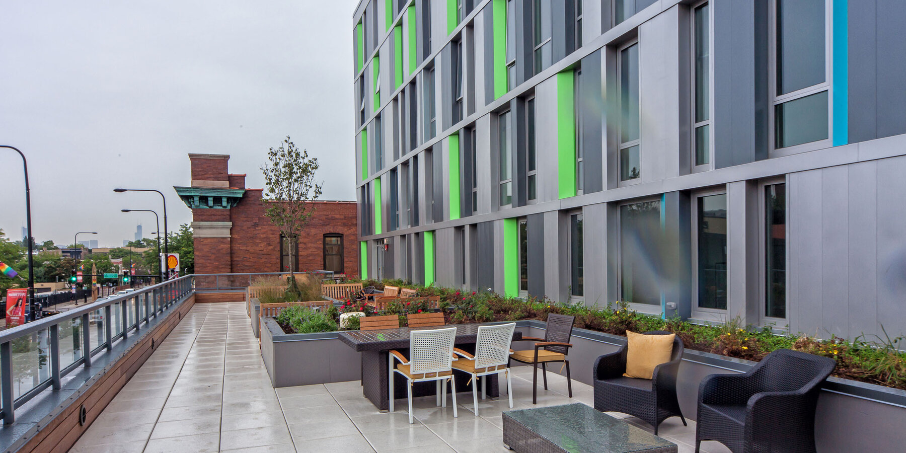 LGBTQ Senior Living Construction - Town Hall Apartments exterior balcony seating