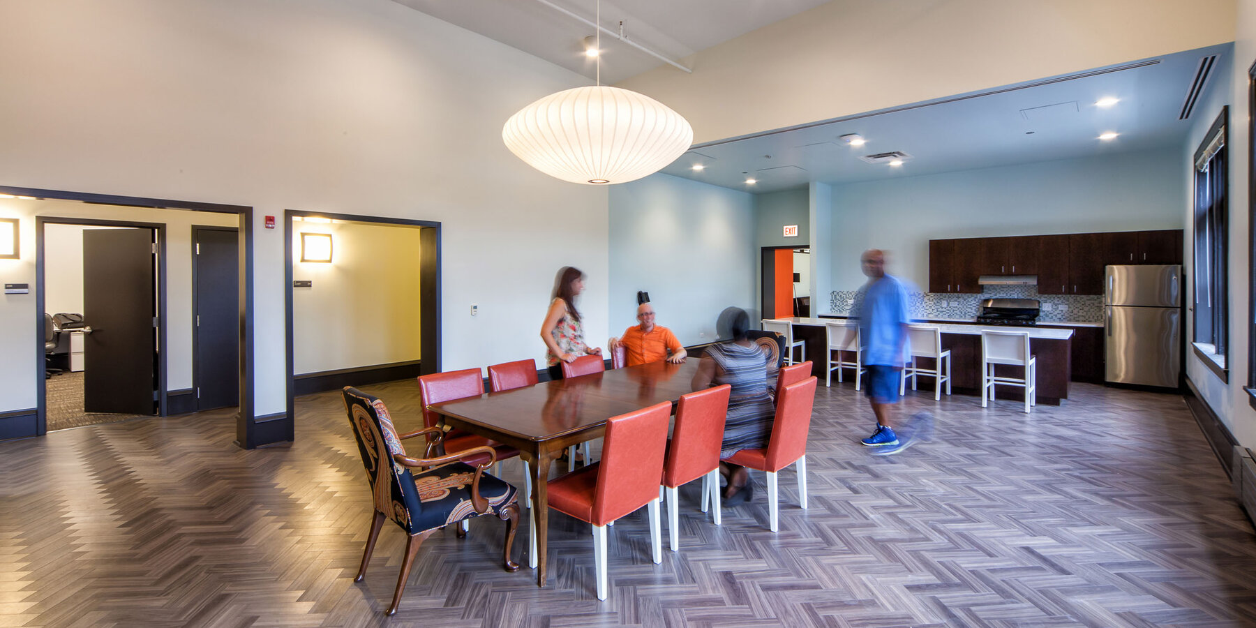 LGBTQ Senior Living Construction - Town Hall Apartments kitchen and dining seating