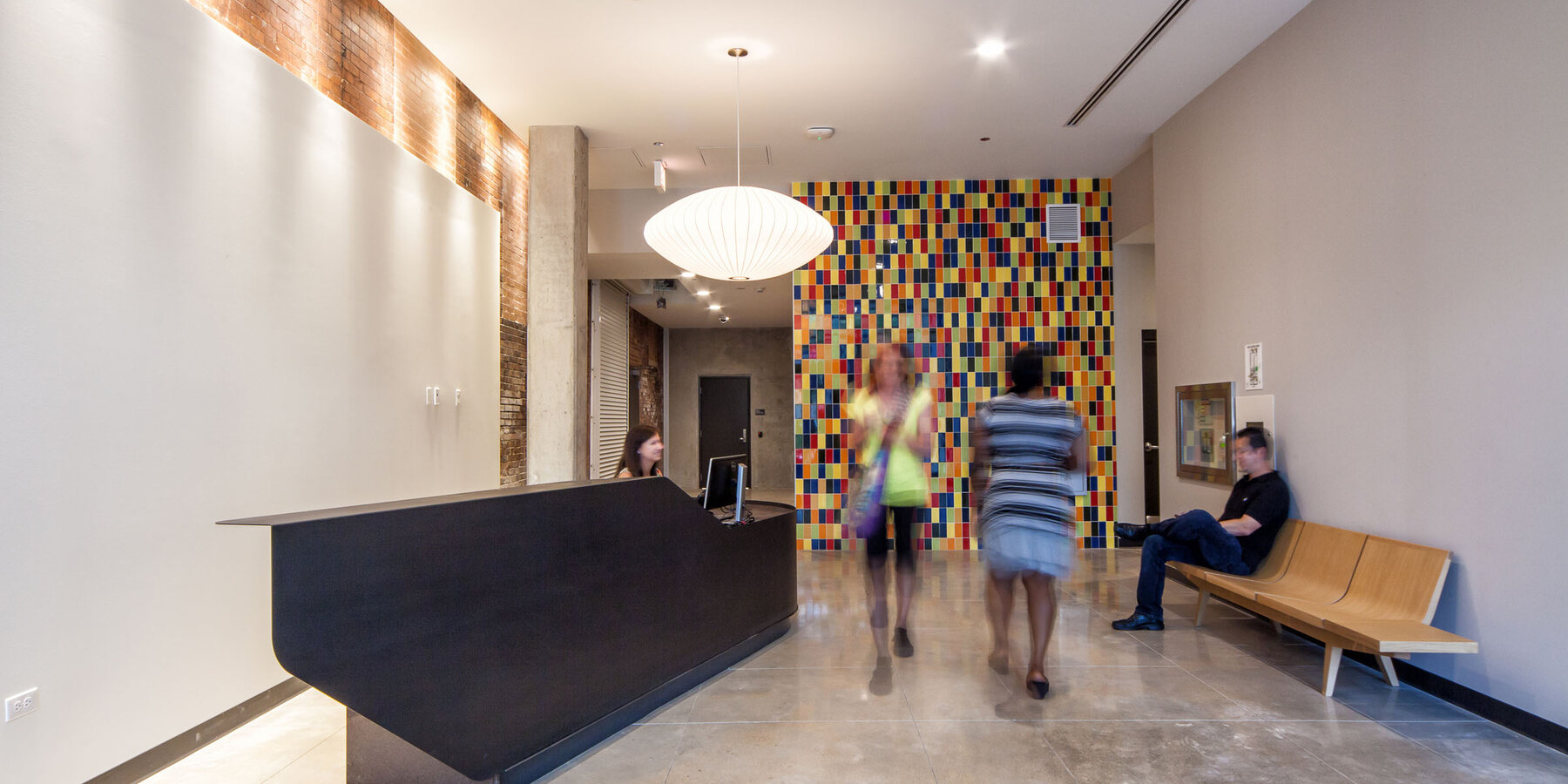 LGBTQ Senior Living Construction - Town Hall Apartments lobby and reception seaating