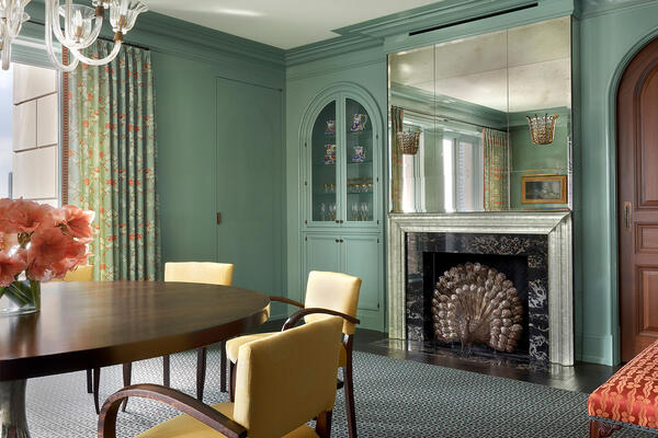 Luxury Custom Home Builders - Waldorf Astoria Residence dining room with fireplace