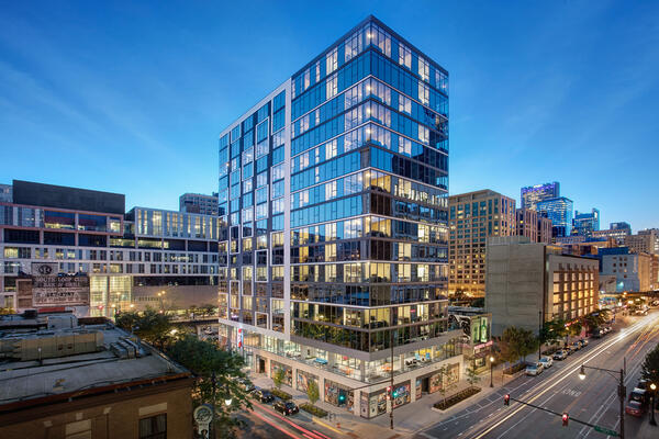 Luxury Apartment Complex Construction - 30 East exterior building at dusk