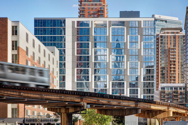 Luxury Apartment Complex Construction - 30 East building with train tracks in foreground