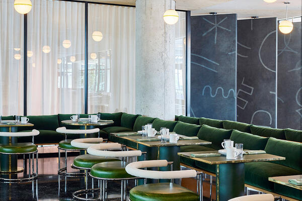 Chicago Restaurant Construction - Ace Hotel Restaurants vintage style dining area with green barstools