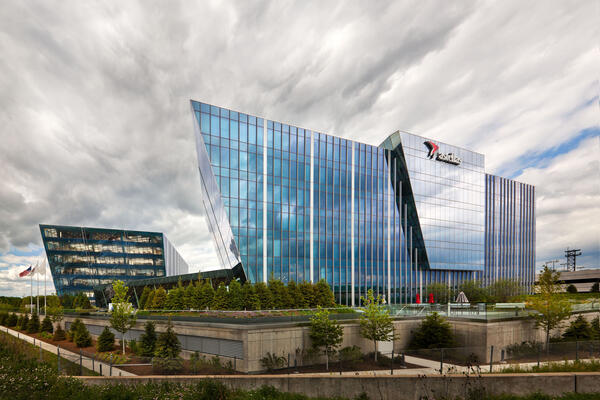 Corporate Office Construction - Astellas Pharma Headquarters exterior view with curtainwall and terraced landscaping