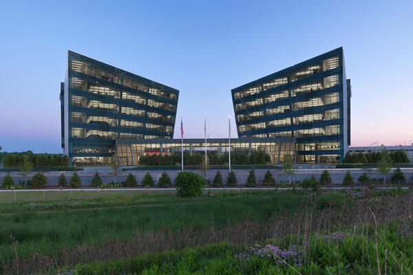 Corporate Office Construction - Astellas Pharma Headquarters two buildings exterior at dusk