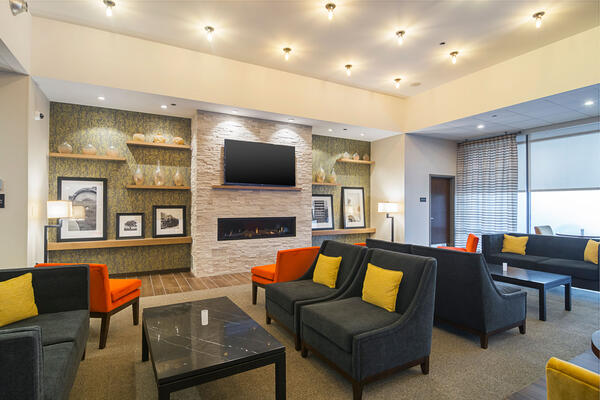 Hospitality Construction Companies - Hampton Inn Loyola lounge area with fireplace