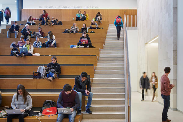 Higher Education Construction - Loyola Schreiber Center Quinlan School of Business grand stairwell with students