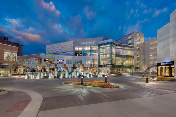 Urban Retail Center Construction - New City Chicago street view with parking at dusk