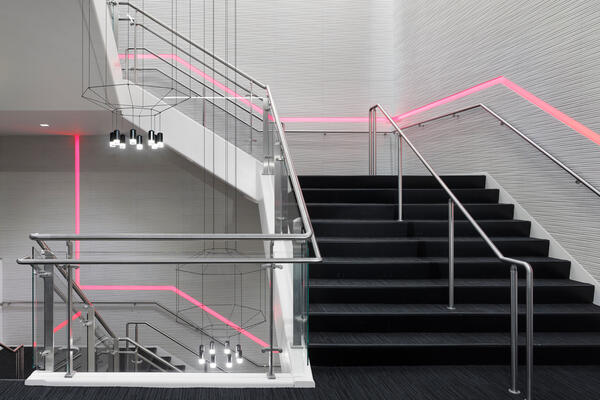 Corporate Office Construction - Northwest Crossings interior stairway with neon lights