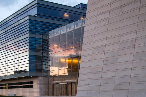 Higher Ed Construction - Northwestern Ryan Center exterior entrance at dusk