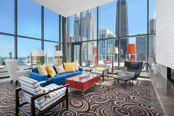 LEED Certified Apartment Construction - State & Chestnut communal lounge space with Chicago skyline and Hancock building views
