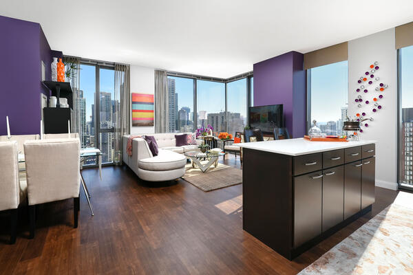 LEED Certified Apartment Construction - State & Chestnut living room with city skyline views