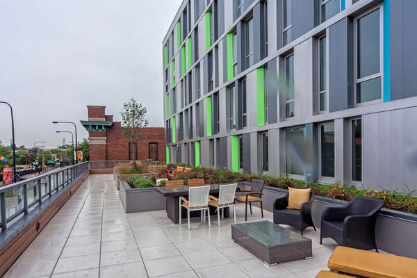 LGBTQ Senior Living Construction - Town Hall Apartments exterior balcony seating