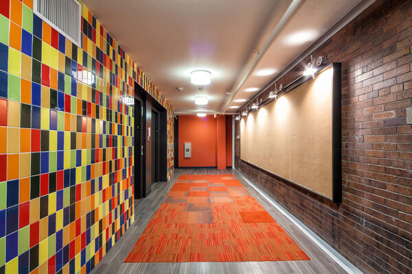 LGBTQ Senior Living Construction - Town Hall Apartments lobby and elevator bay